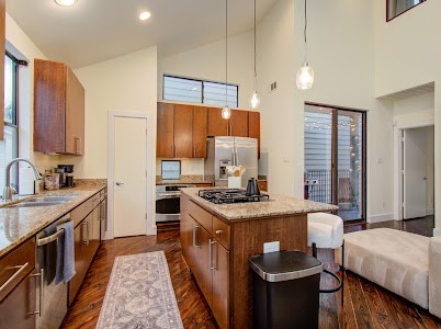 4510 Maxie Street, Unit B Houston, TX 77007 - Photo 27 of 39 a kitchen with stainless steel appliances granite countertop a stove a sink dishwasher and a refrigerator
