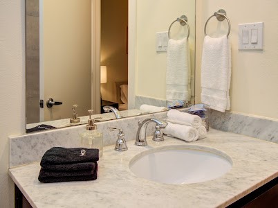 4510 Maxie Street, Unit B Houston, TX 77007 - Photo 35 of 39 a bathroom with a granite countertop sink and a mirror