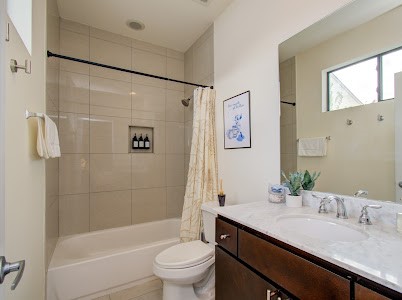 4510 Maxie Street, Unit B Houston, TX 77007 - Photo 5 of 39 a bathroom with a granite countertop sink toilet and shower