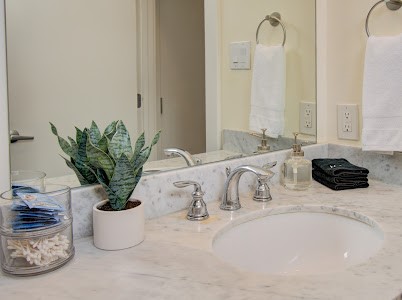 4510 Maxie Street, Unit B Houston, TX 77007 - Photo 7 of 39 a bathroom with a double sink and a mirror