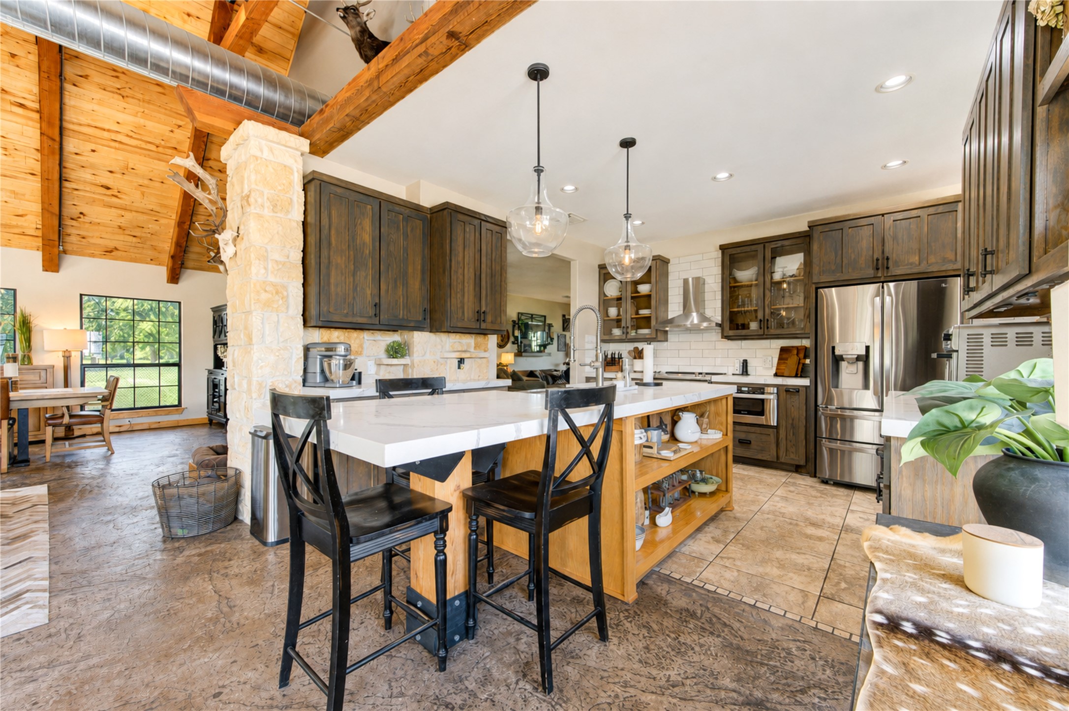 22313 Chapman Road Hempstead, TX 77445 - Photo 9 of 50 At the center of the kitchen is a stunning 9-foot 6-inch island with Calacatta quartz countertop.