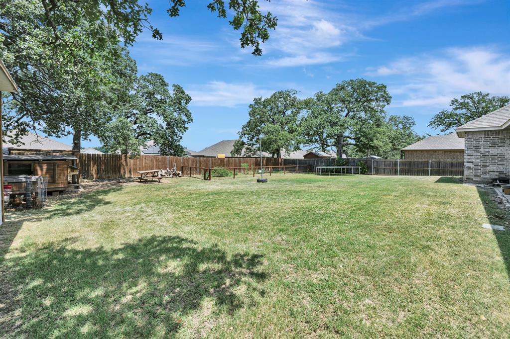 917 East 3rd Street Springtown, TX 76082 - Photo 5 of 32 So much room for pets, play, activities, entertaining, hobbies, etc...