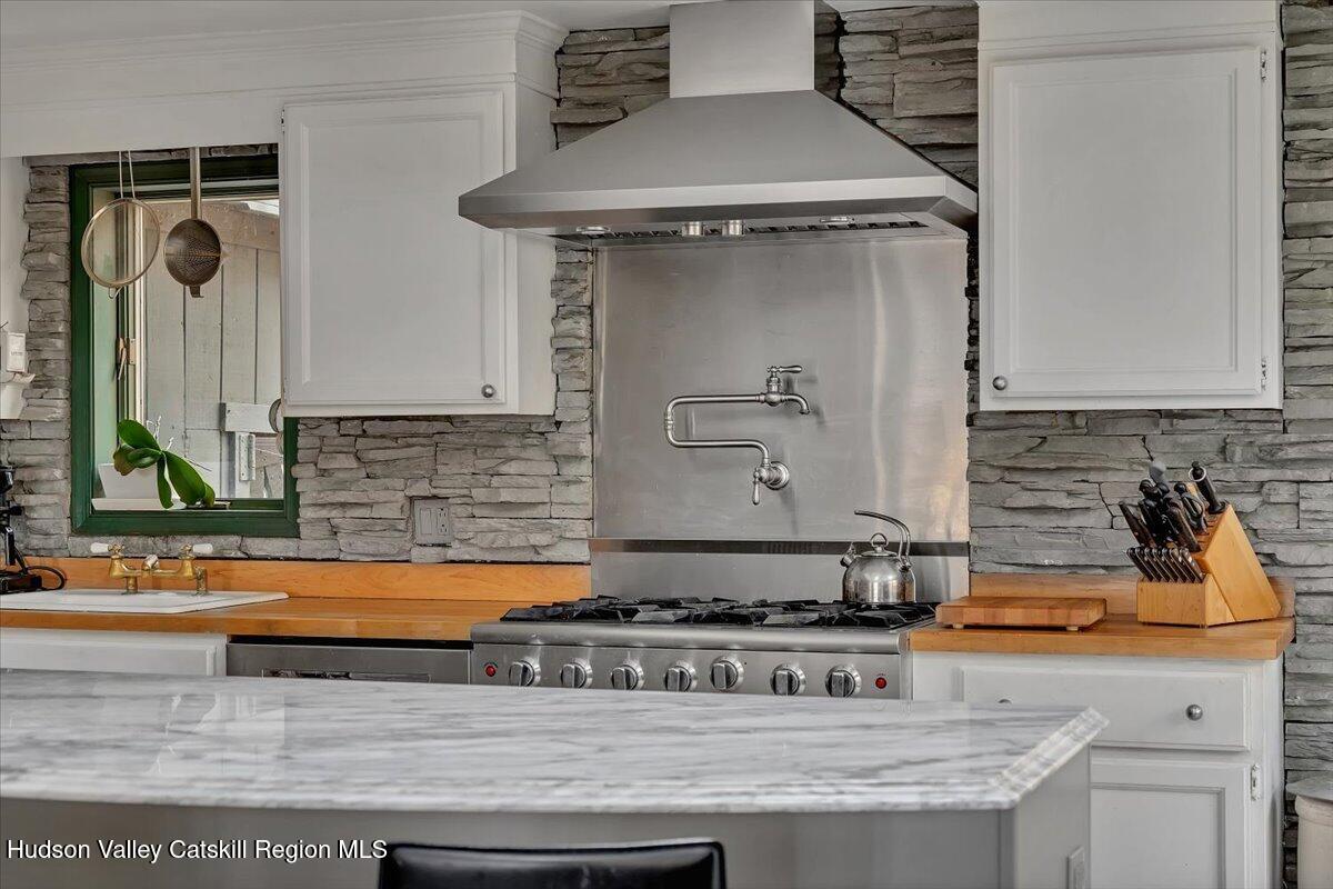 126 Storks Nest Road Round Top, NY 12473 - Photo 12 of 43 a kitchen with a stove and a cabinets