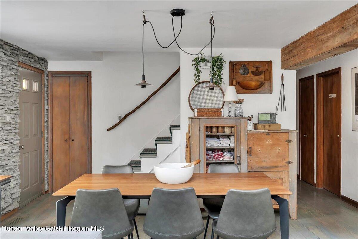 126 Storks Nest Road Round Top, NY 12473 - Photo 13 of 44 a view of a livingroom with furniture wooden floor and window