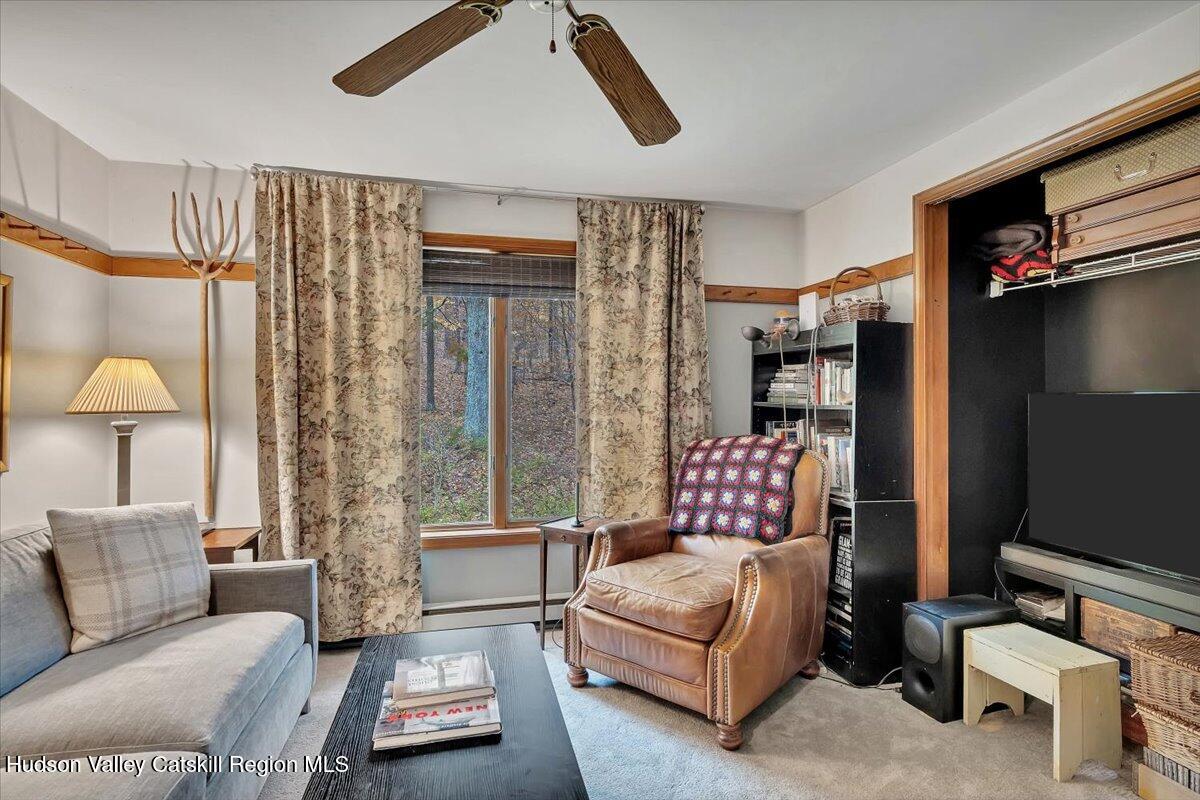 126 Storks Nest Road Round Top, NY 12473 - Photo 18 of 43 a living room with furniture and a flat screen tv