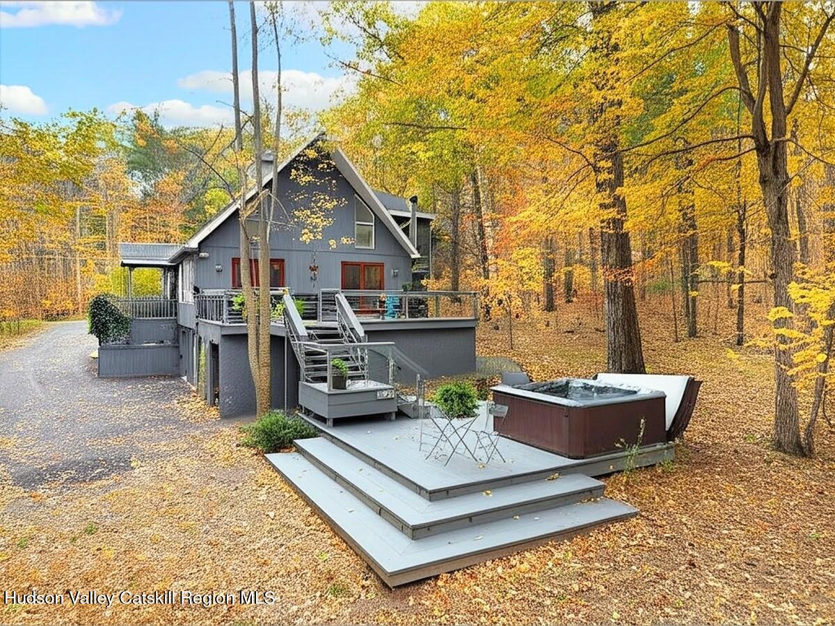 126 Storks Nest Road Round Top, NY 12473 - Photo 29 of 43 a living room with furniture and a table