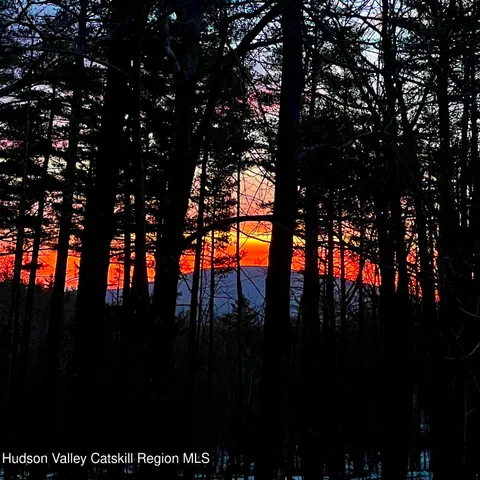 a balcony with table and chairs
