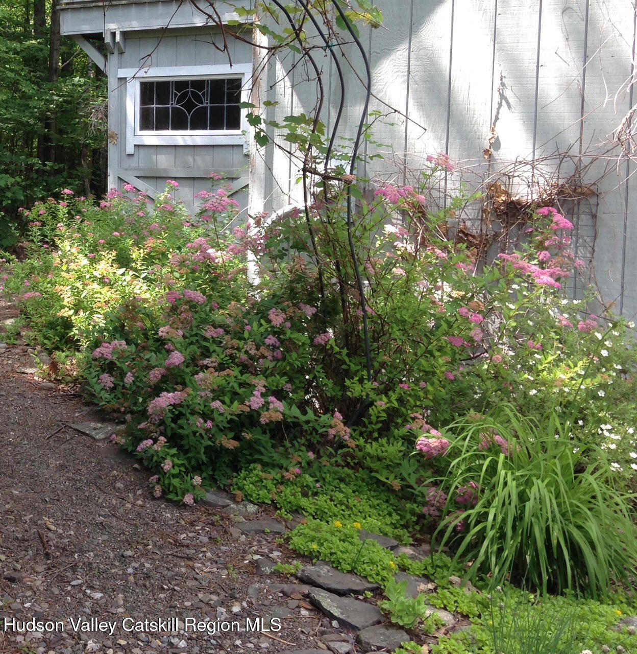 126 Storks Nest Road Round Top, NY 12473 - Photo 33 of 44 a backyard of a house with table and chairs