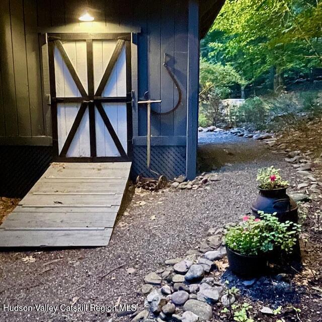 126 Storks Nest Road Round Top, NY 12473 - Photo 34 of 44 a view of house with backyard and sitting area