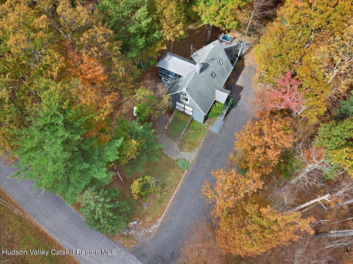126 Storks Nest Road Round Top, NY 12473 - Photo 36 of 44 an aerial view of a house with a yard and garden