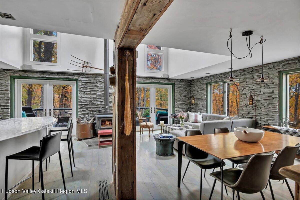126 Storks Nest Road Round Top, NY 12473 - Photo 4 of 44 a view of a dining room with furniture window and outside view
