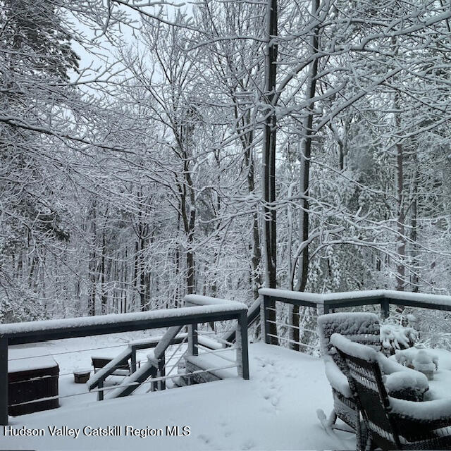 126 Storks Nest Road Round Top, NY 12473 - Photo 39 of 43 a balcony with table and chairs
