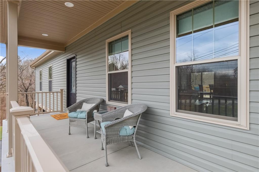 2388 Ridge Road Extension Ambridge, PA 15003 - Photo 2 of 44 a view of a patio with table and chairs and couches with wooden floor and fence