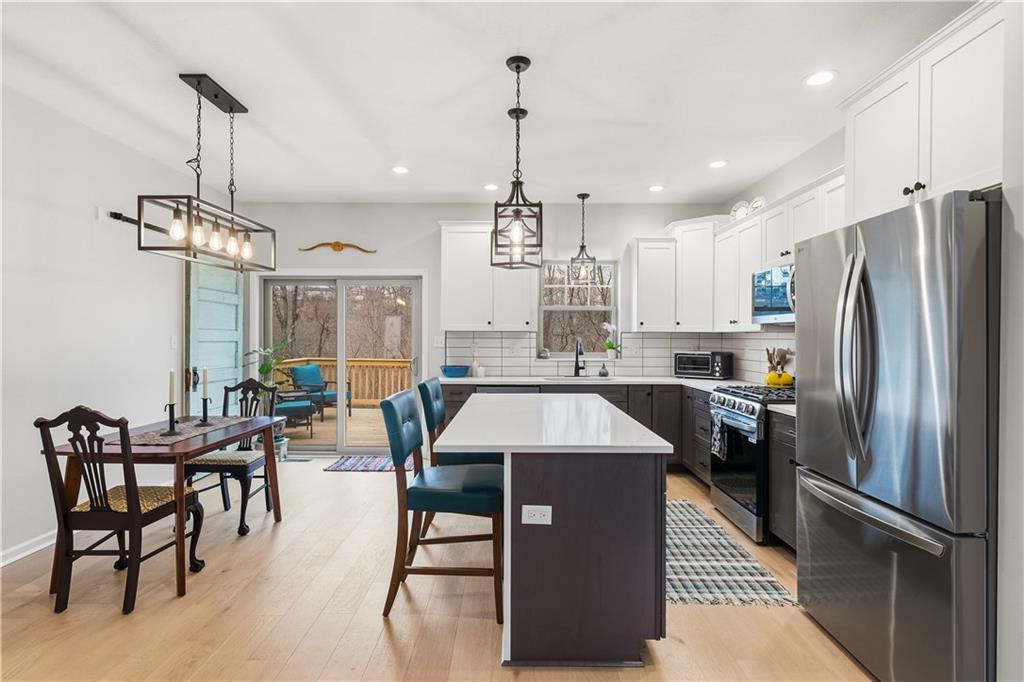 2388 Ridge Road Extension Ambridge, PA 15003 - Photo 10 of 44 a large kitchen with a table and chairs