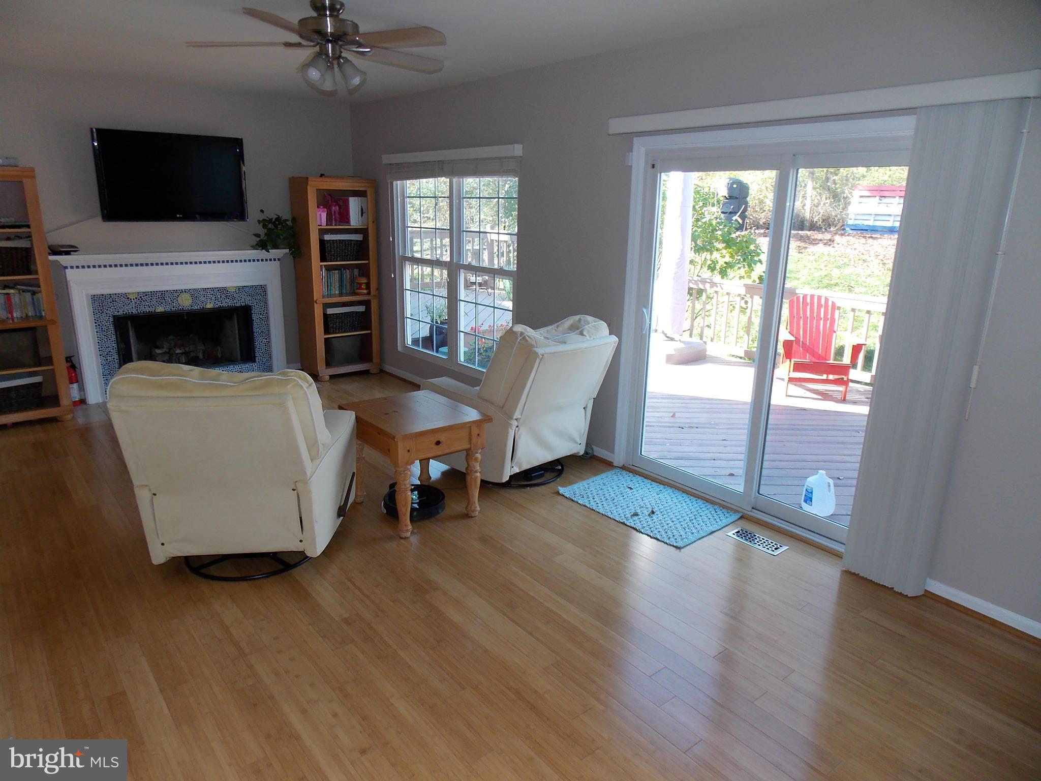 429 Deer Path Avenue Southwest Leesburg, VA 20175 - Photo 11 of 30 a living room with furniture and a flat screen tv