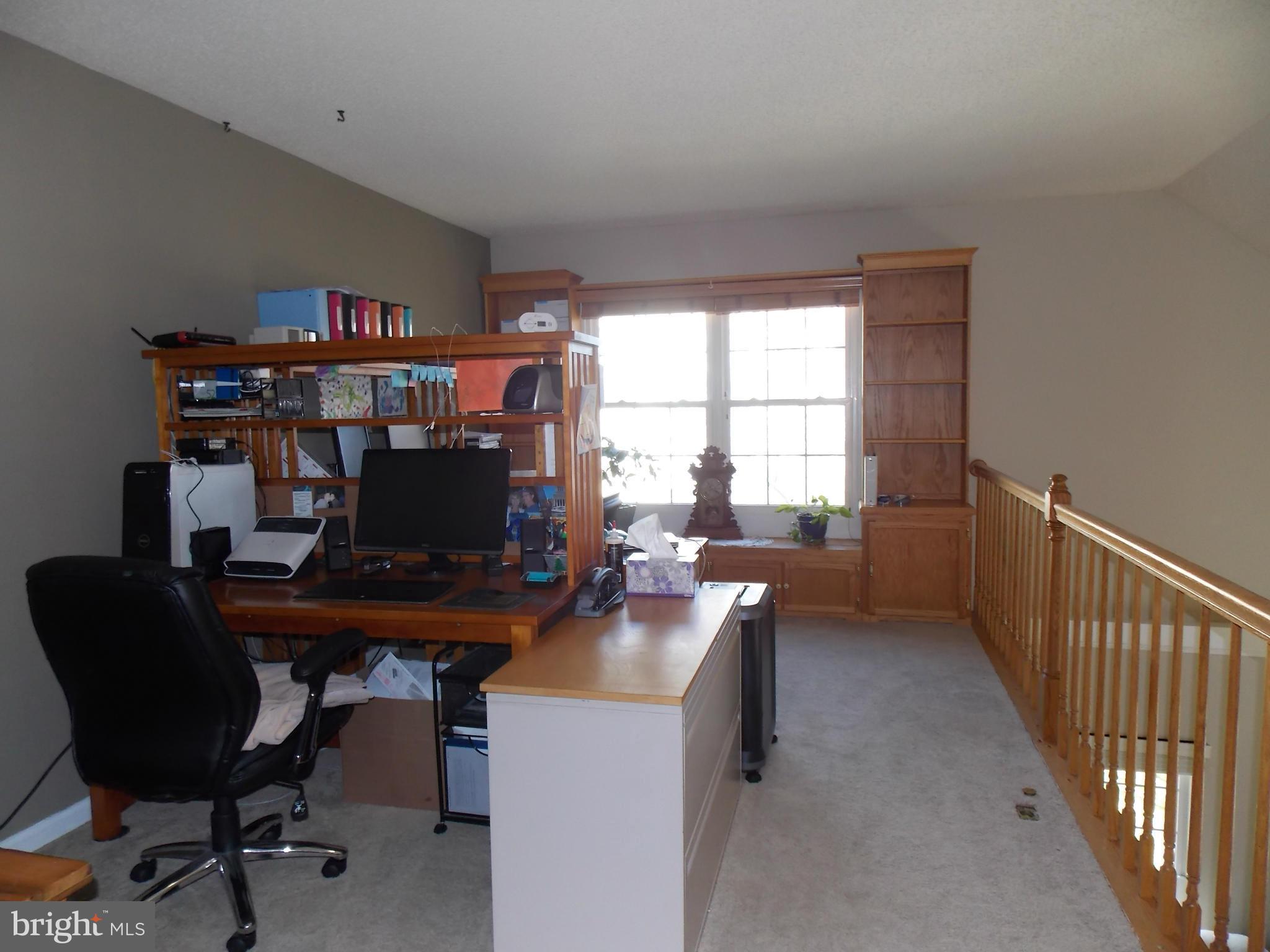 429 Deer Path Avenue Southwest Leesburg, VA 20175 - Photo 17 of 30 a view of a workspace with furniture and a window