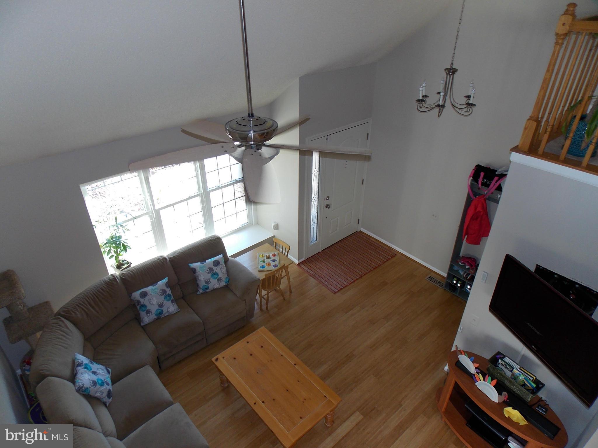 429 Deer Path Avenue Southwest Leesburg, VA 20175 - Photo 5 of 30 a living room with furniture and a flat screen tv