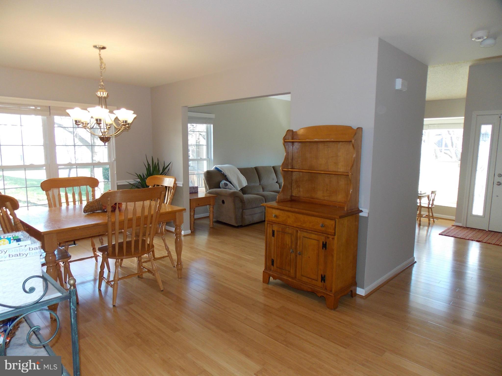 429 Deer Path Avenue Southwest Leesburg, VA 20175 - Photo 6 of 30 a living room with furniture and a chandelier