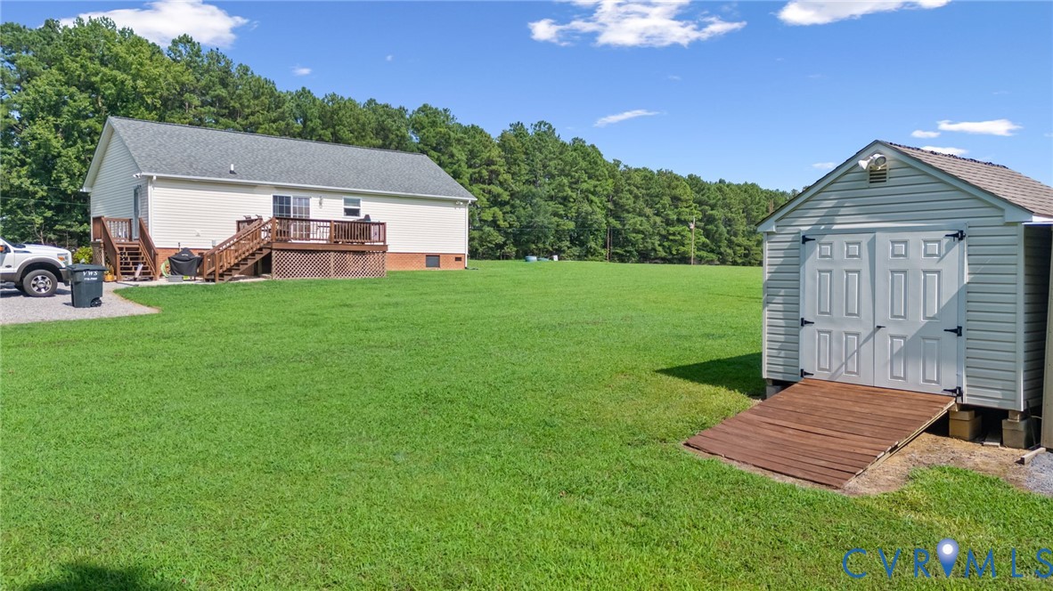 10910 Courthouse Road Dinwiddie, VA 23841 - Photo 36 of 38 Expansive green lawn with a detached shed featurin
