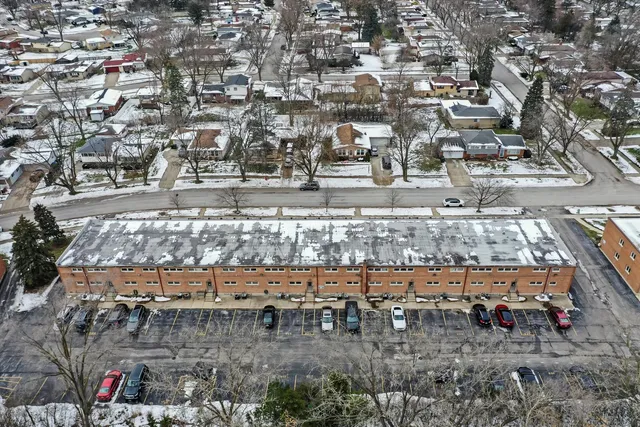 a view of a water fountain and a bench