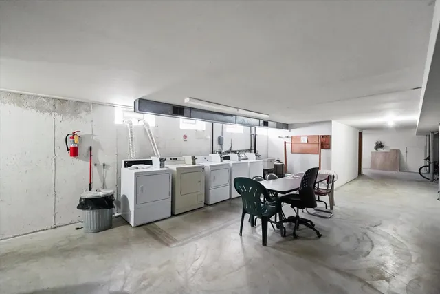 a view of a dining area with furniture and chandelier