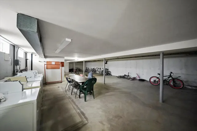 a view of a livingroom with furniture and a window