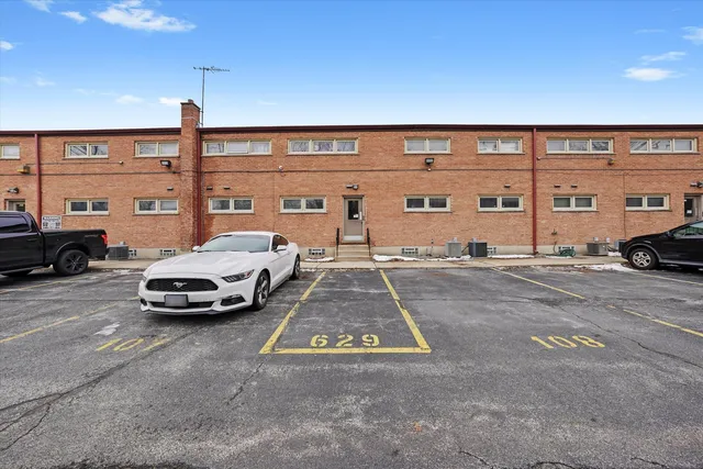 a view of parking with cars parked