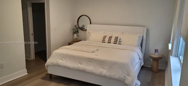 a bedroom with a bed and a sink