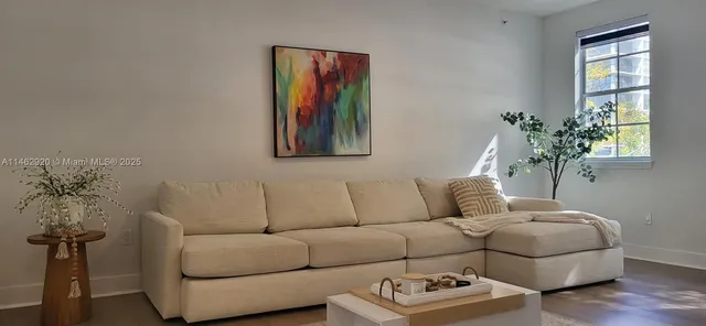 a living room with furniture and a window