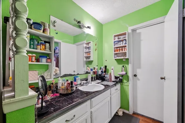 a bathroom with a double vanity sink and a mirror