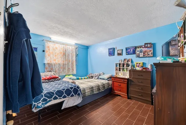 a bedroom with a bed and closet