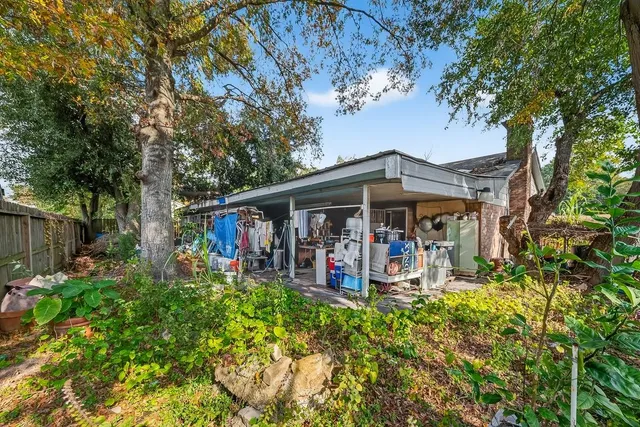 a view of a house with a backyard of the house