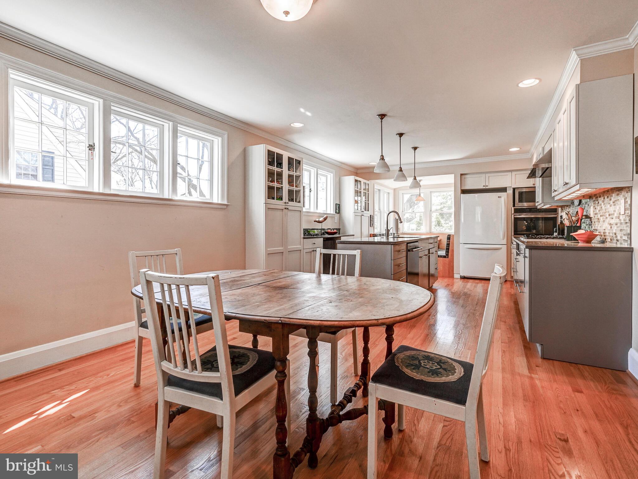 207 Cedarcroft Road Baltimore, MD 21212 - Photo 14 of 50 a view of a a dining room with furniture window and wooden floor