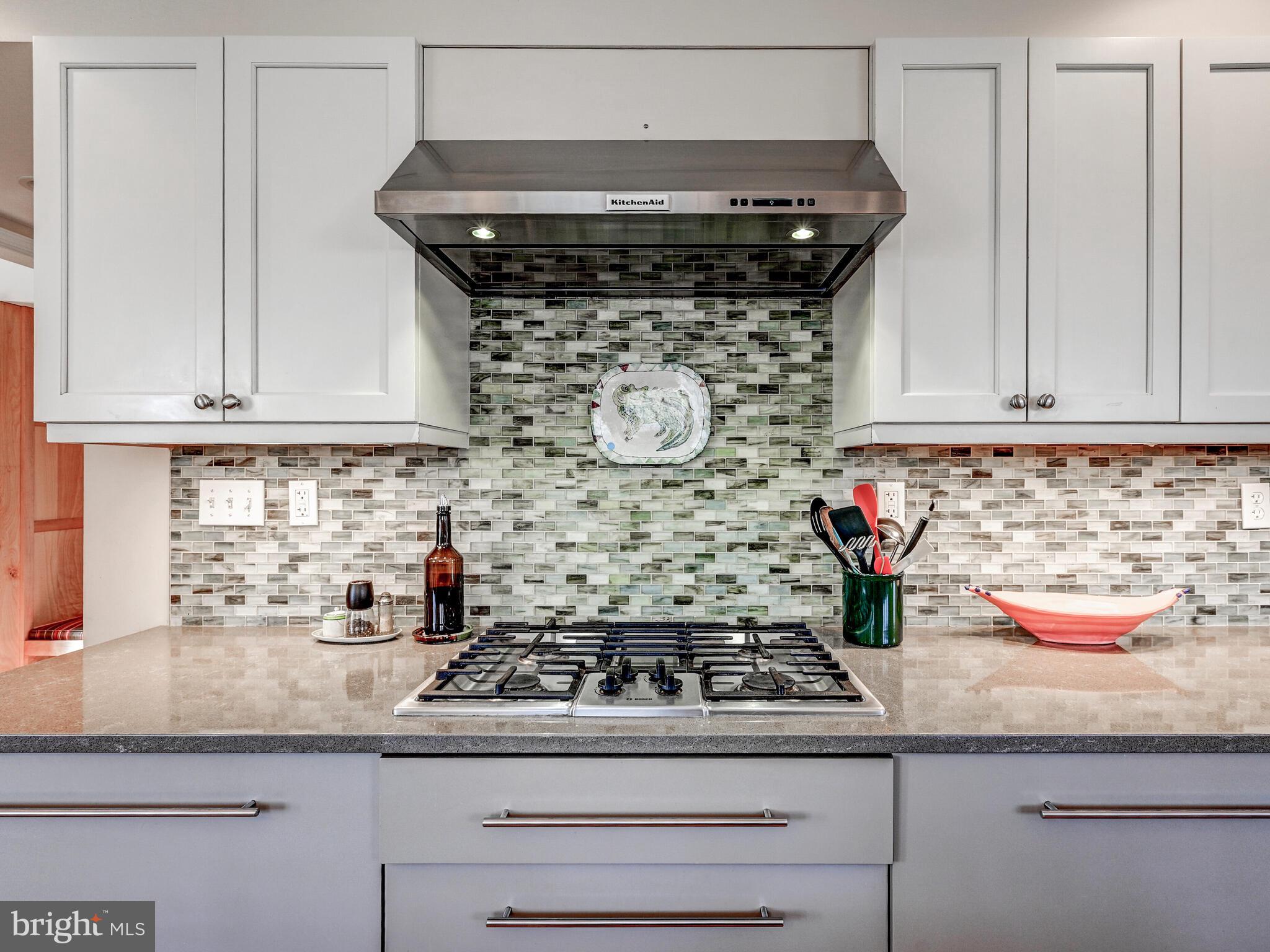 207 Cedarcroft Road Baltimore, MD 21212 - Photo 20 of 50 a stove top oven sitting inside of a kitchen and granite counter tops