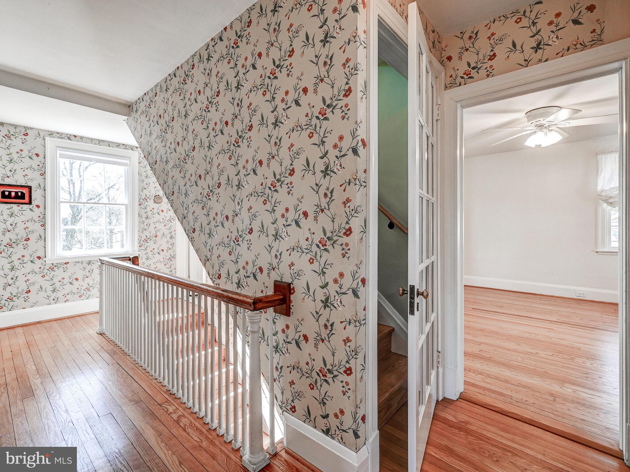 207 Cedarcroft Road Baltimore, MD 21212 - Photo 24 of 50 a view of a hallway with wooden floor and staircase