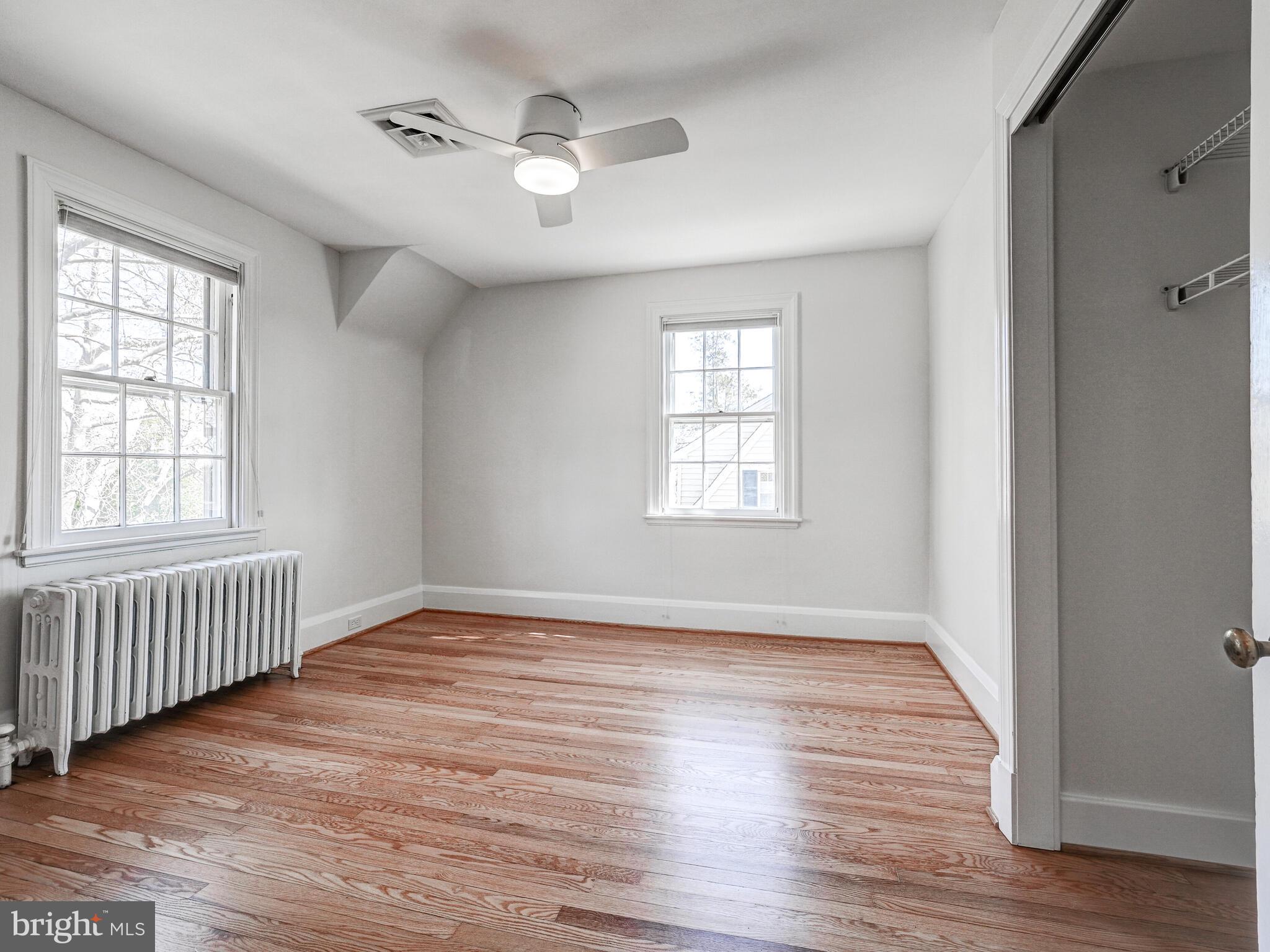 207 Cedarcroft Road Baltimore, MD 21212 - Photo 28 of 50 wooden floor in an empty room with a window