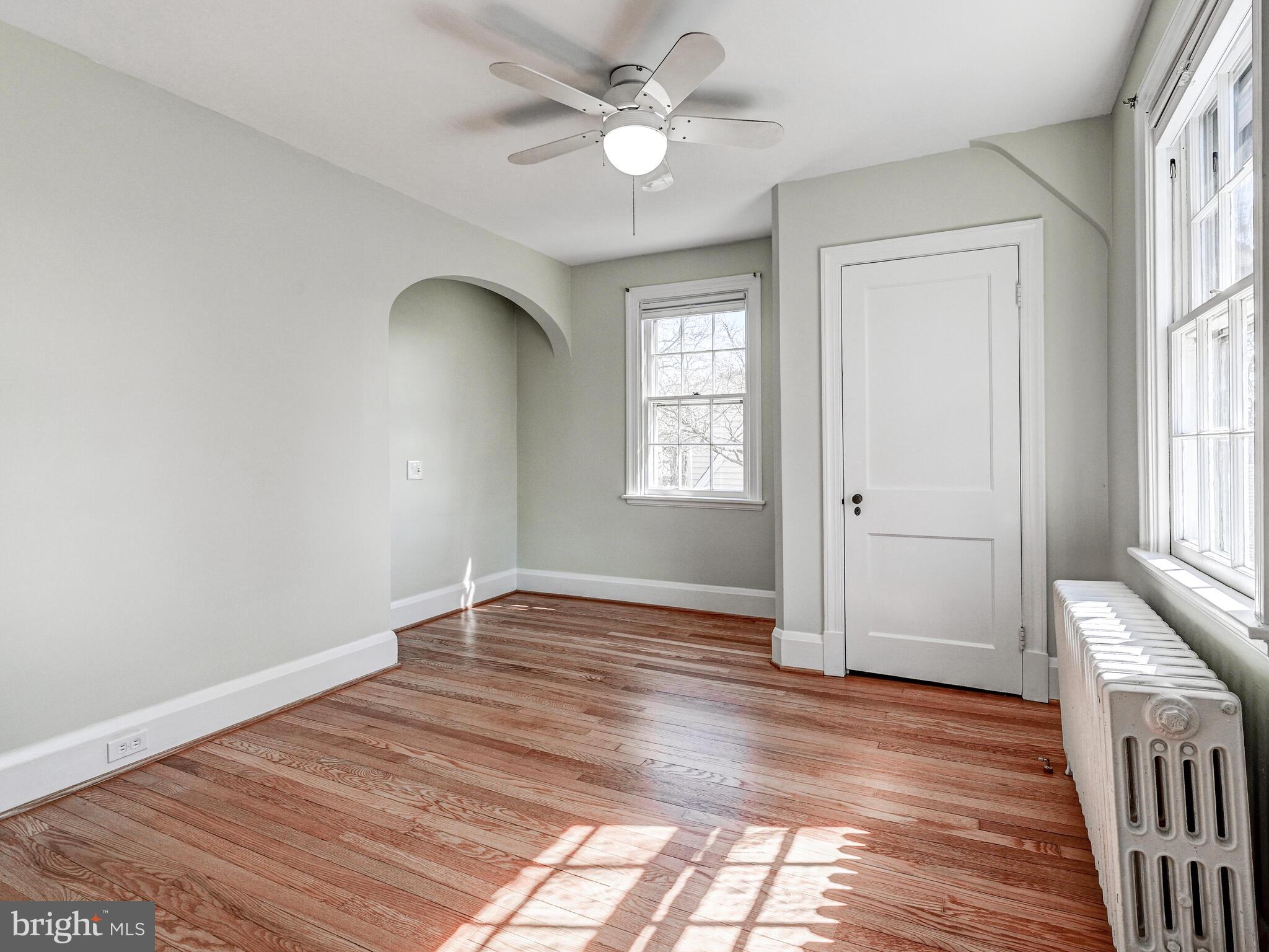207 Cedarcroft Road Baltimore, MD 21212 - Photo 29 of 50 wooden floor in an empty room with a window
