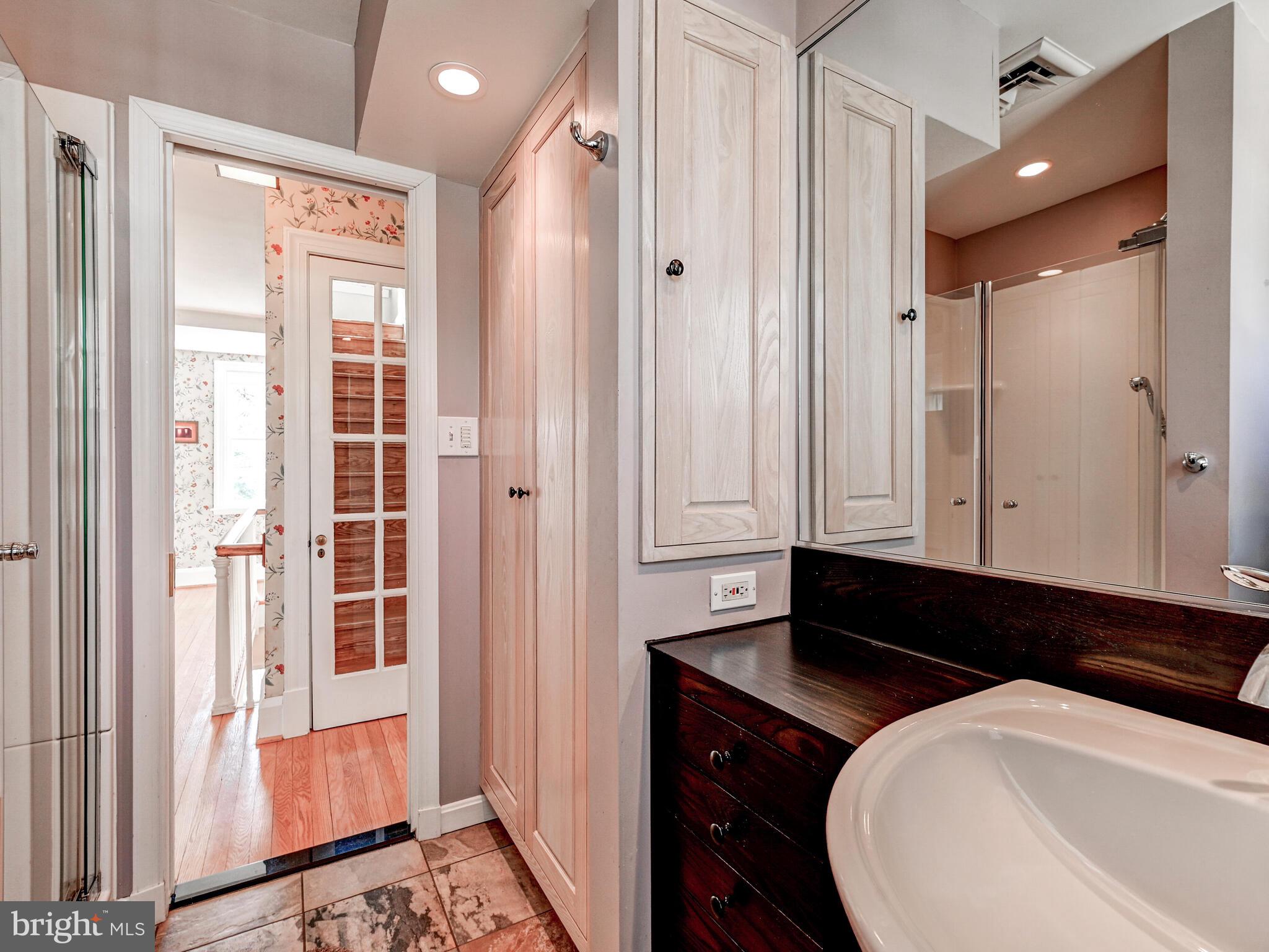 207 Cedarcroft Road Baltimore, MD 21212 - Photo 31 of 50 a bathroom with a sink and a mirror