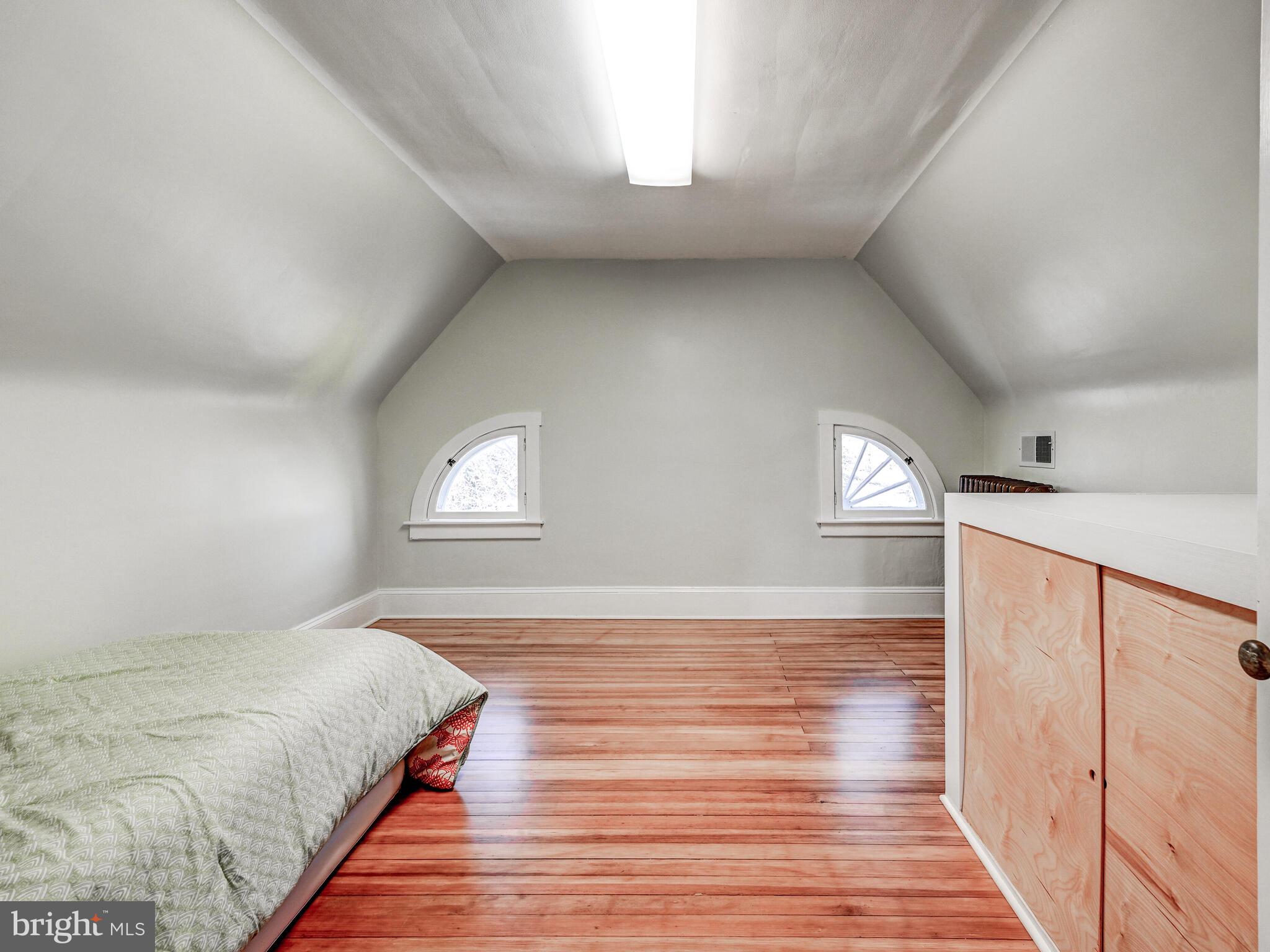 207 Cedarcroft Road Baltimore, MD 21212 - Photo 34 of 50 a bedroom with a bed and a window