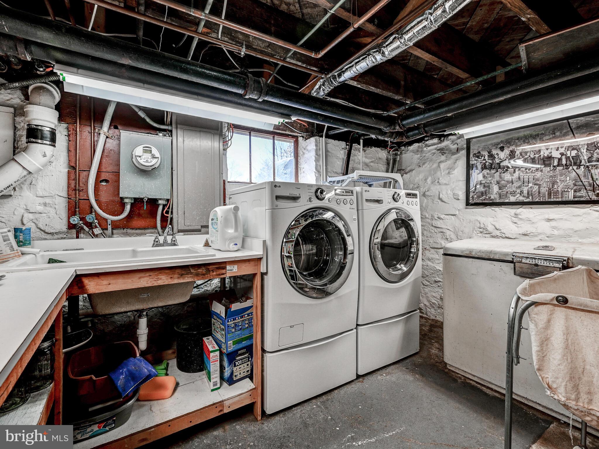 207 Cedarcroft Road Baltimore, MD 21212 - Photo 36 of 50 a utility room with dryer and washer