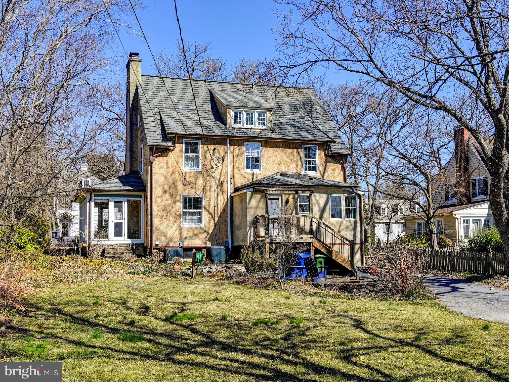 207 Cedarcroft Road Baltimore, MD 21212 - Photo 39 of 50 a view of a white house with large windows next to a road