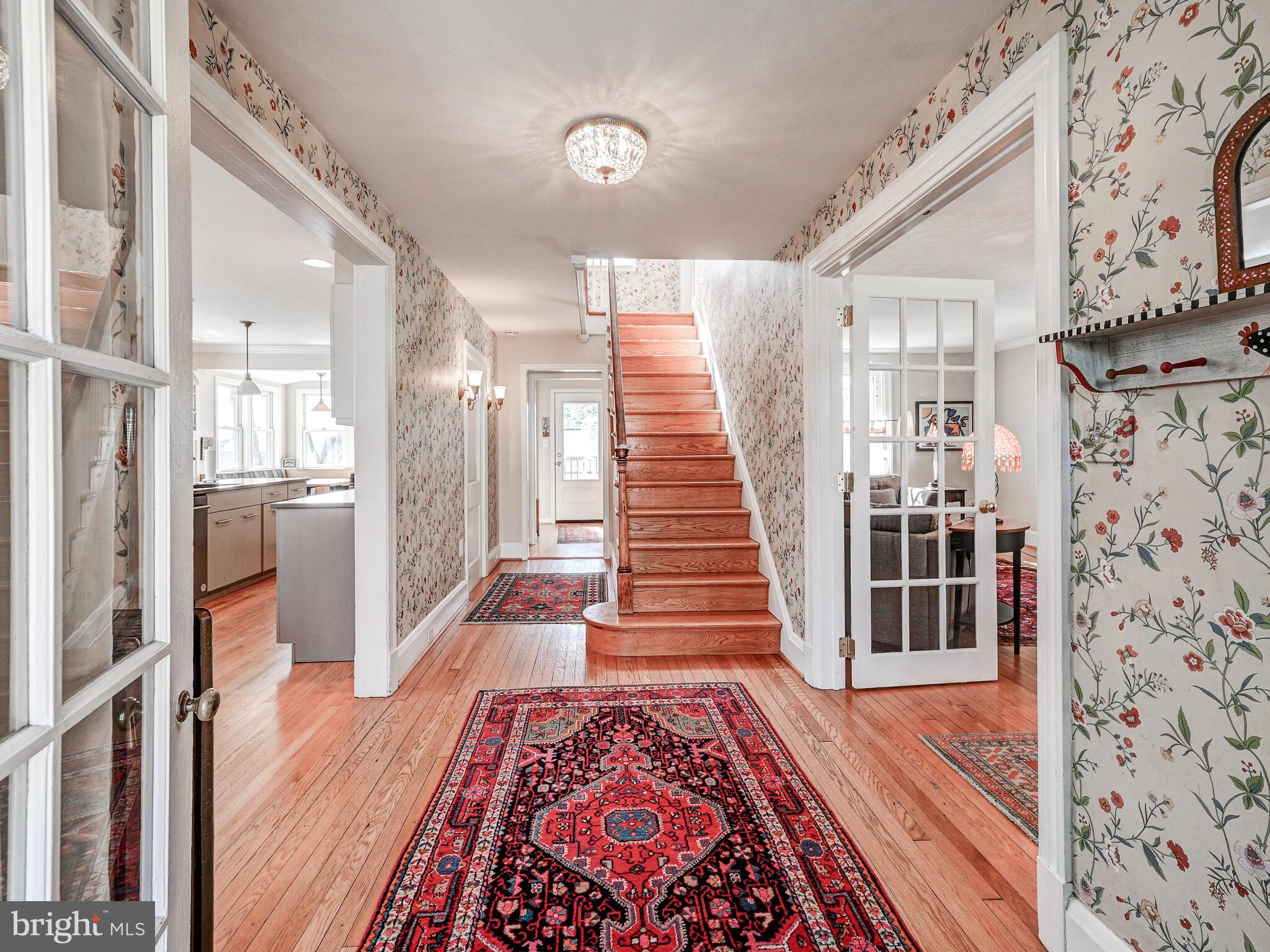 207 Cedarcroft Road Baltimore, MD 21212 - Photo 6 of 50 a view of a hallway with wooden floor and staircase
