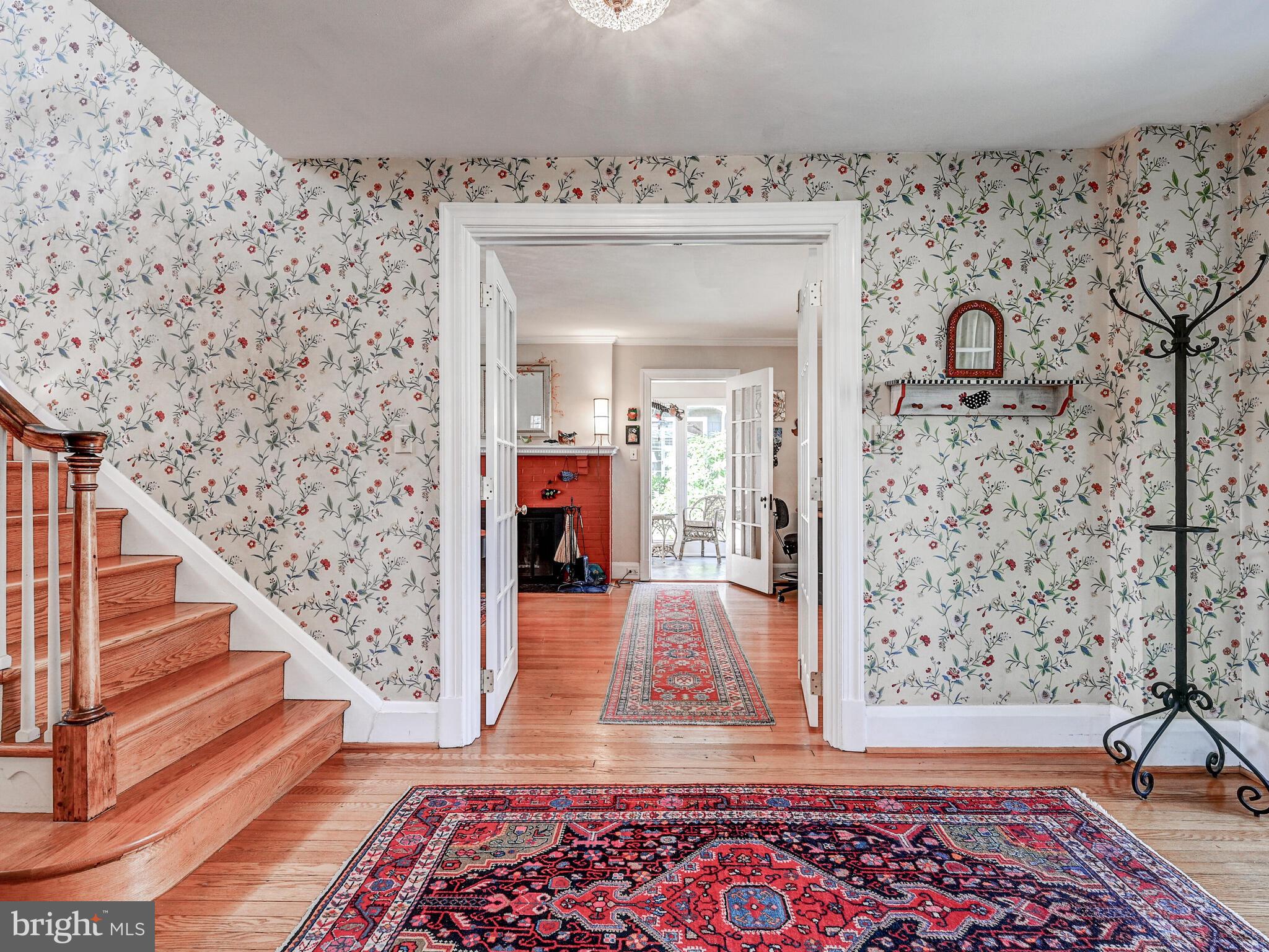 207 Cedarcroft Road Baltimore, MD 21212 - Photo 7 of 50 a view of a hallway with wooden floor and staircase