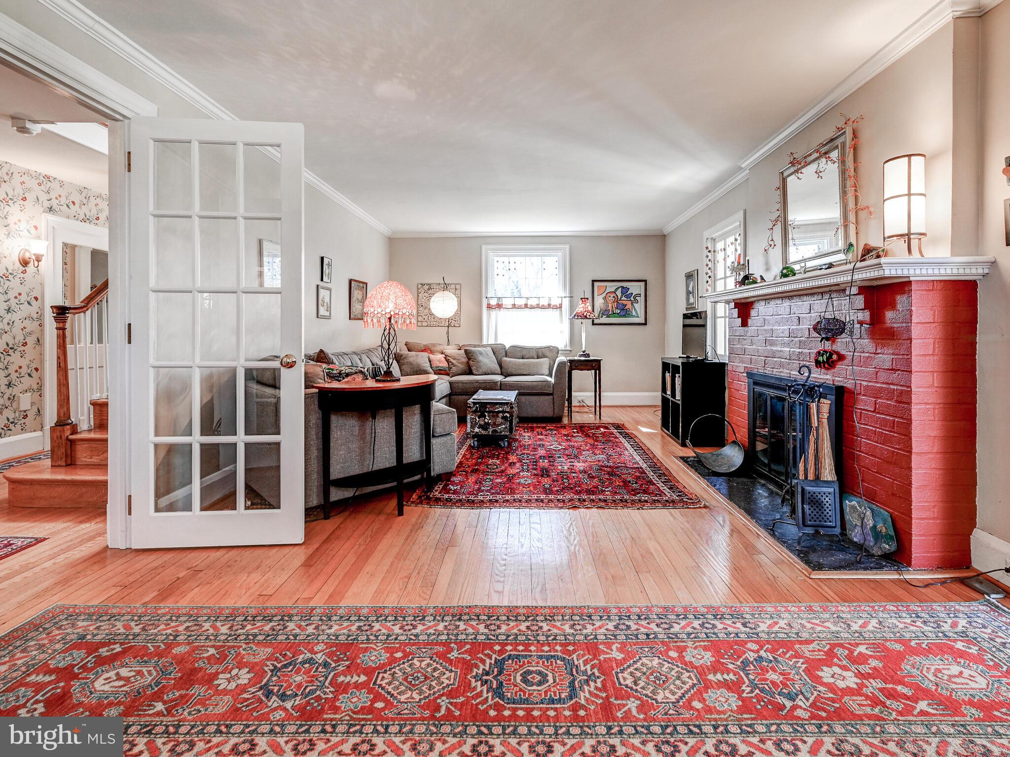 207 Cedarcroft Road Baltimore, MD 21212 - Photo 9 of 50 a very nice looking room with a rug and a fireplace