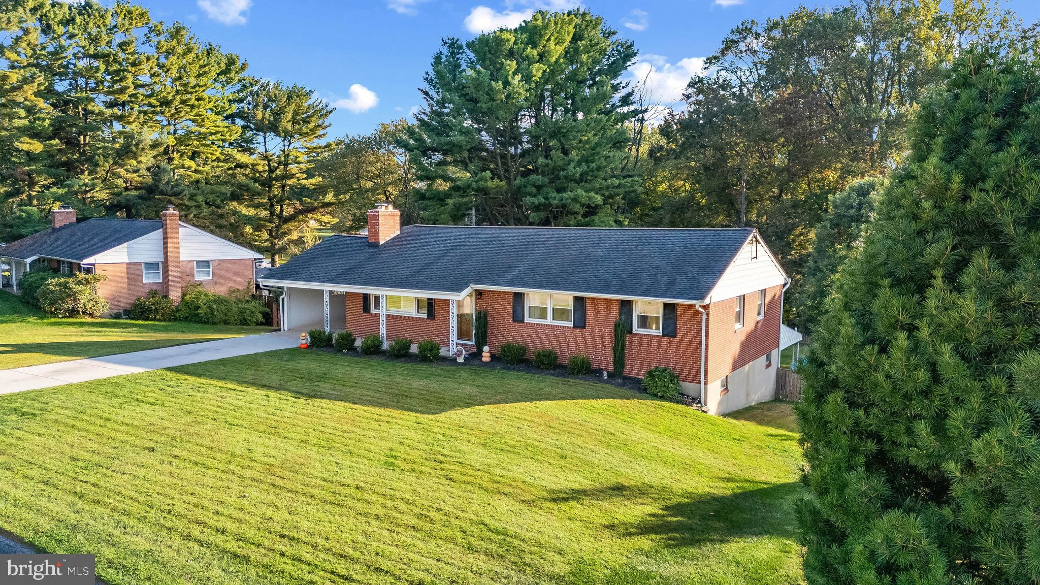 a front view of a house with yard