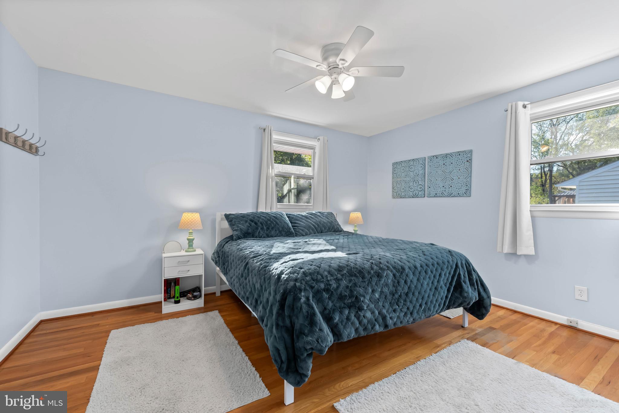 419 Wake Robin Drive Cockeysville, MD 21030 - Photo 18 of 20 a bedroom with a bed and a chandelier