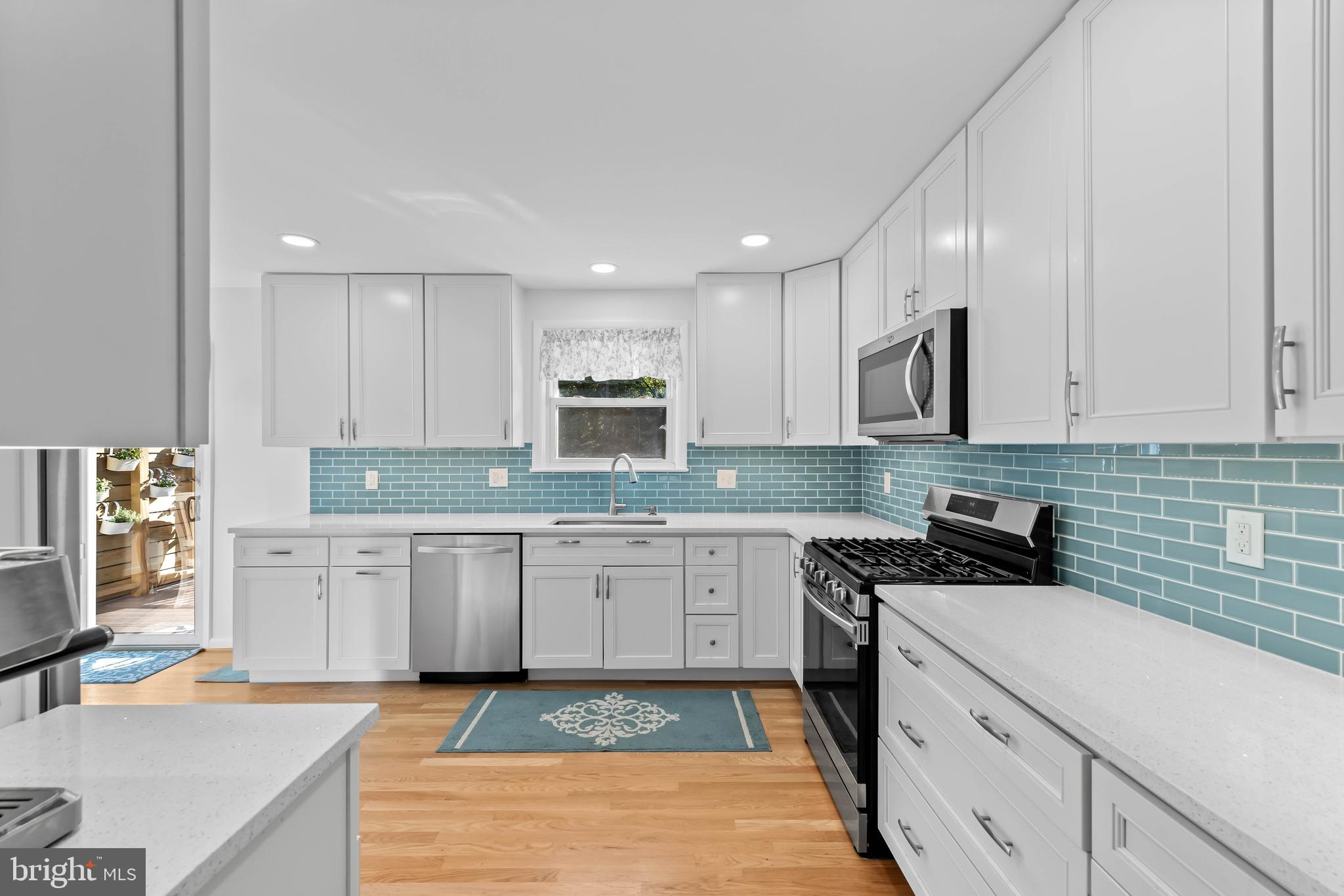 419 Wake Robin Drive Cockeysville, MD 21030 - Photo 2 of 20 a large kitchen with cabinets stainless steel appliances a sink and a stove