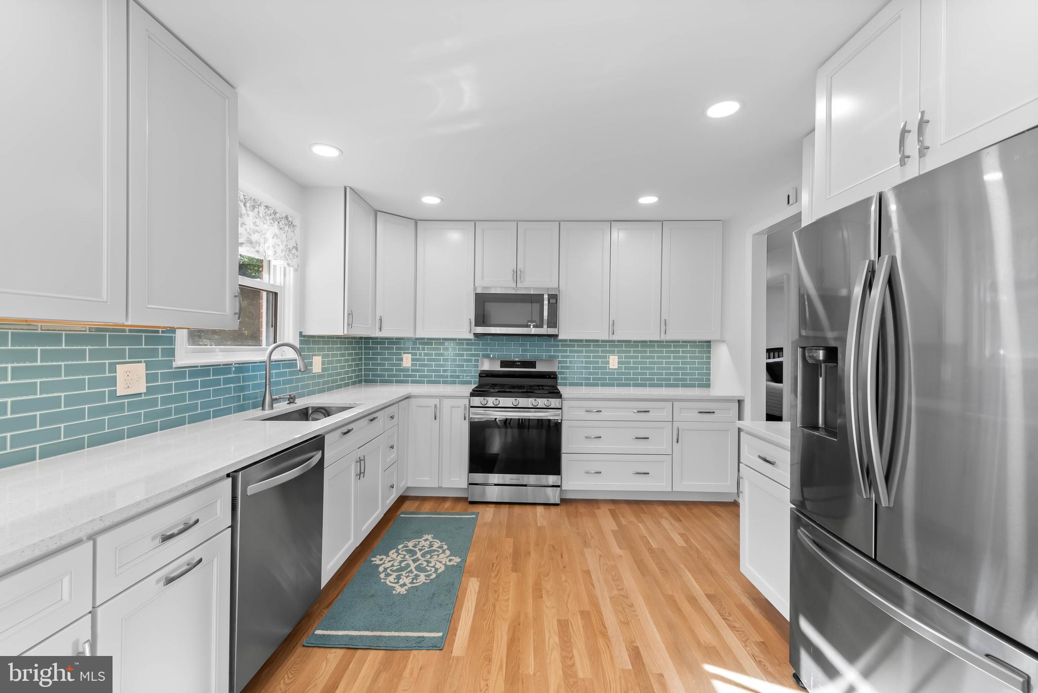 419 Wake Robin Drive Cockeysville, MD 21030 - Photo 7 of 20 a kitchen with stainless steel appliances a refrigerator sink and microwave