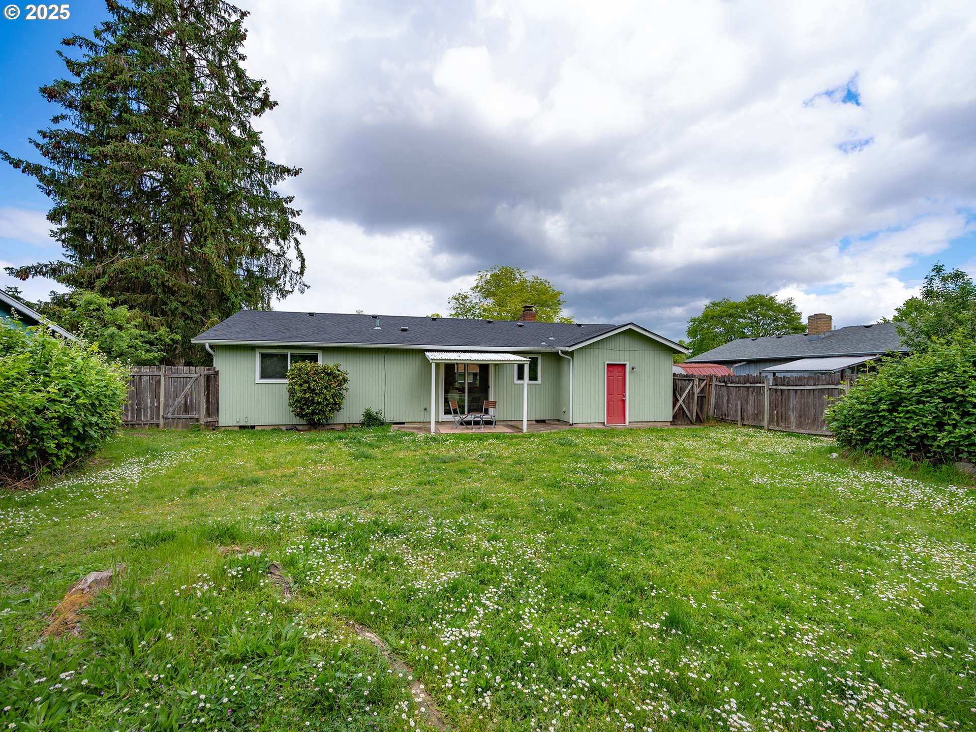 1376 Buck Street Eugene, OR 97402 - Photo 26 of 31 a front view of house with yard and trees