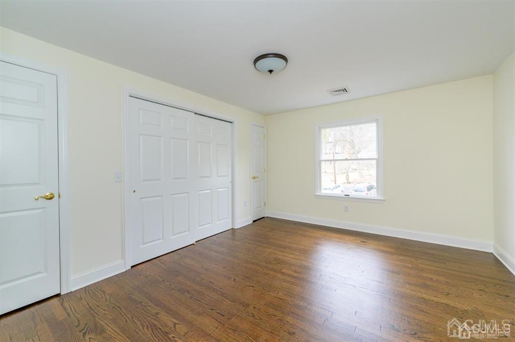 11 Little Philadelphia Road Washington, NJ 07882 - Photo 21 of 48 an empty room with wooden floor and windows